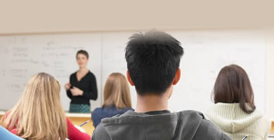 Image of an instructor in fromt of classroom